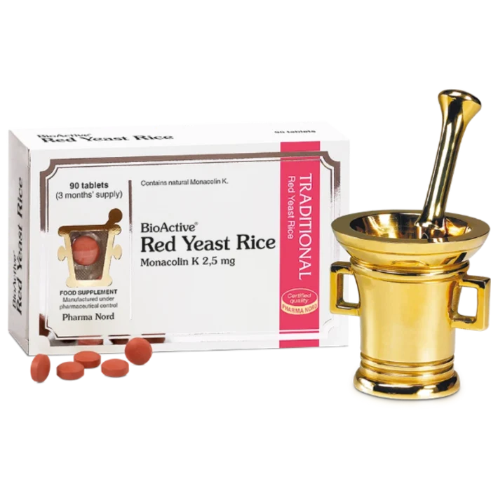BioActive Red Yeast Rice Monacolin K 2.5 mg tablets shown with their white and pink retail box, several red-orange tablets in front, and a gold-colored mortar and pestle on a white background.