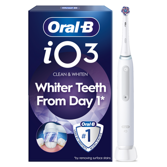 Oral-B iO3 Quite White electric toothbrush beside navy blue box reading "Clean & Whiten, Whiter Teeth From Day 1" on white background