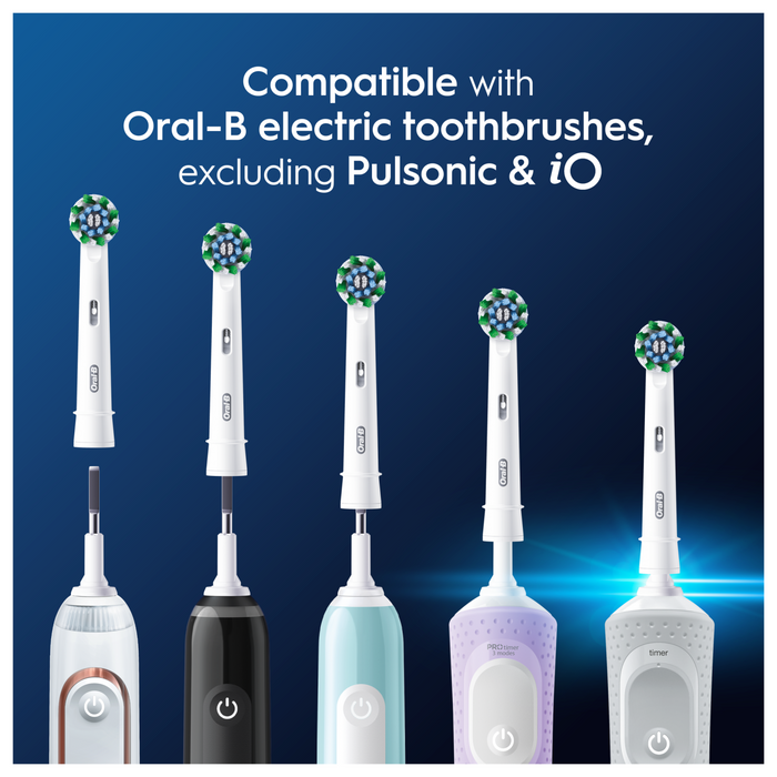 Oral-B Pro Cross Action toothbrush heads on five electric handles against dark blue background, text reads "Compatible with Oral-B electric toothbrushes, excluding Pulsonic & iO"
