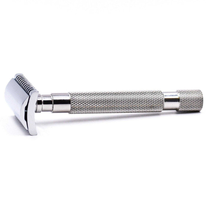 Close-up of stainless steel safety razor handle with textured grip