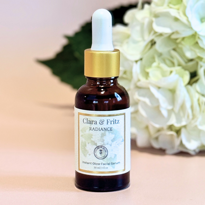 Radiance Instant Glow Facial Serum bottle with hydrating formula and floral background
