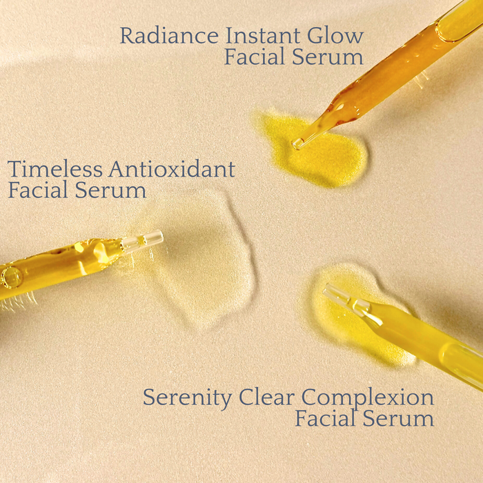 Serenity Clear Complexion Facial Serum with droppers showcasing serum's texture and color beside other facial serums.