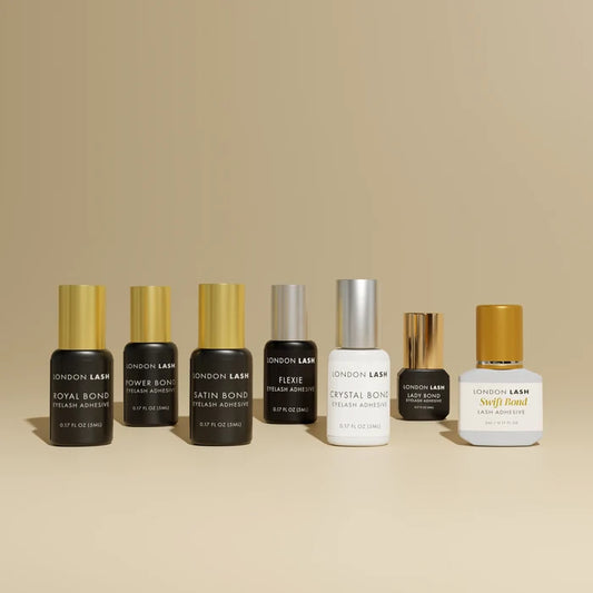 Collection of London Lash Glue bottles for the London Lash Glue Subscription plan, showing different adhesive options available in the UK.