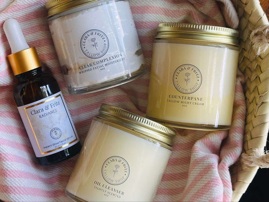 The Complete Facial Skincare Routine products including oil cleanser, moisturizer, cream, and serum displayed in a woven basket.